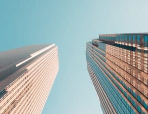 Two skyscrapers against blue sky