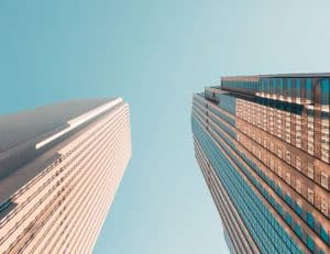 Two skyscrapers against blue sky