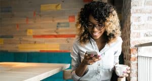 Woman checking her interactive payslips on mobile phone
