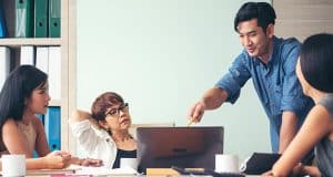 Man assisting team with workforce management