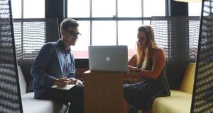 Employees looking at a laptop