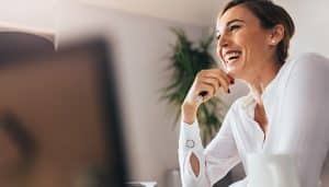 Woman working on laptop in home office