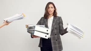 Woman overwhelmed by manual payroll administration